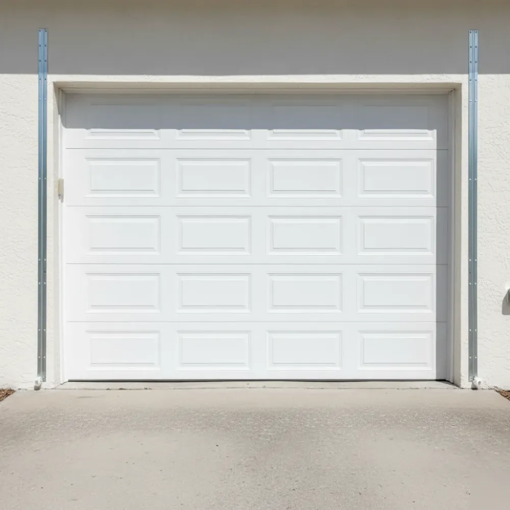 Freshly serviced residential garage door sitting flush and evenly aligned against a stucco exterior wall in Hallandale Beach.