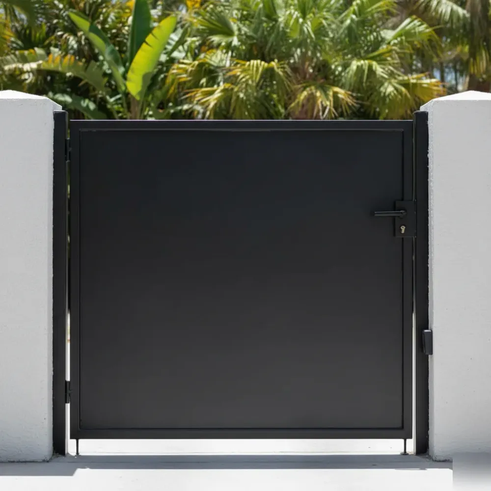 Repaired black steel swing gate latched flush and level against a stucco pillar at a Hallandale Beach home.
